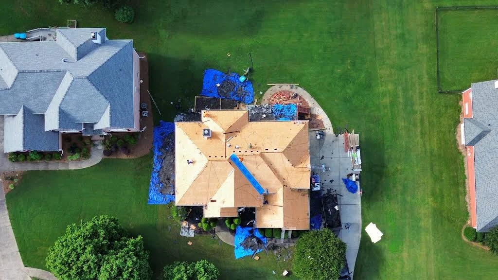 Overhead photograph of wood decking on a residential roof